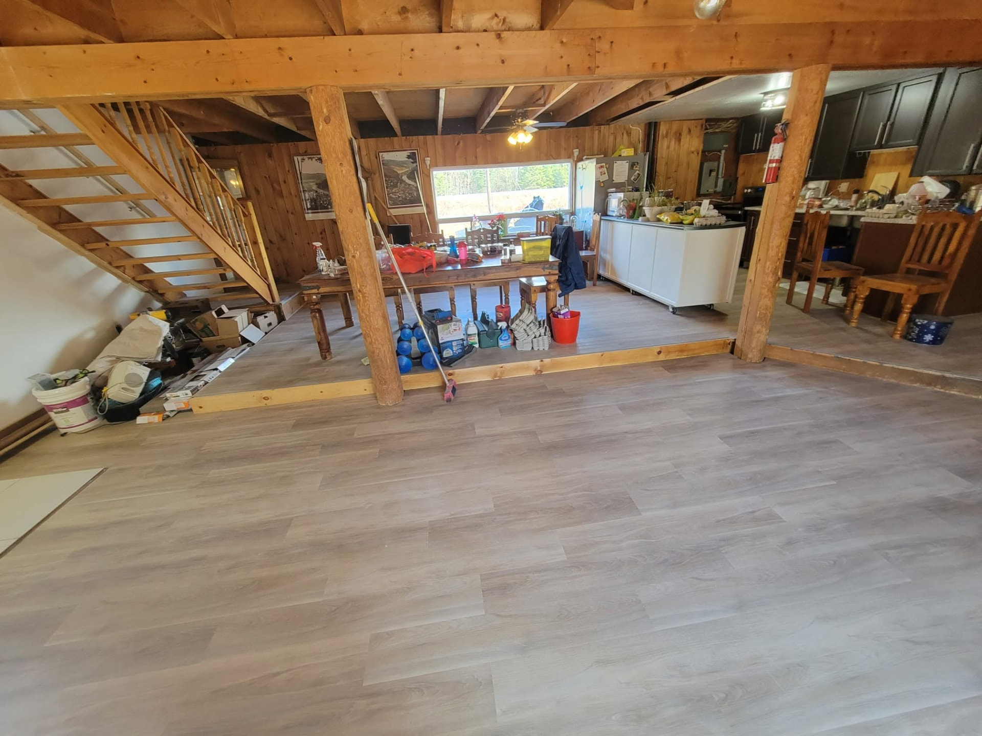 Open basement with freshly installed flooring