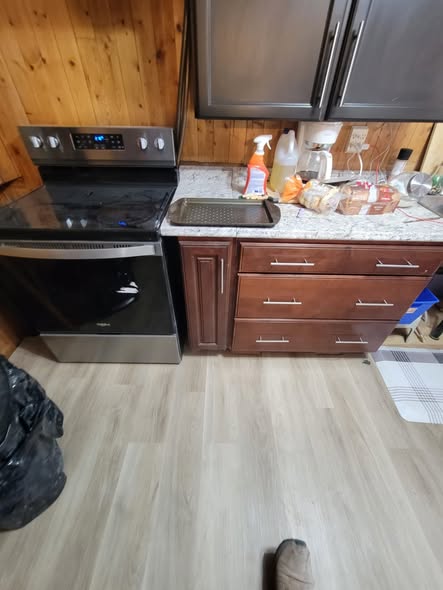 Kitchen with new light plank flooring