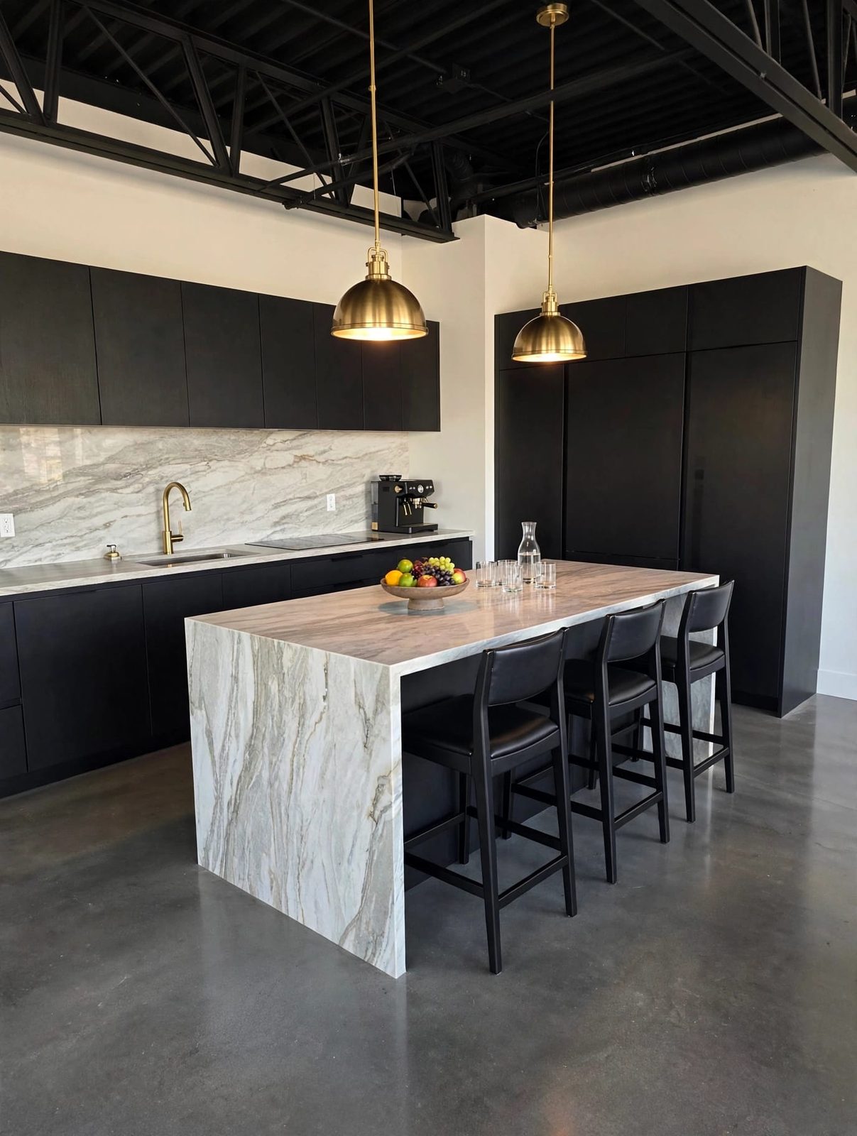 Kitchen after: matte black cabinetry, stone island and brass pendants