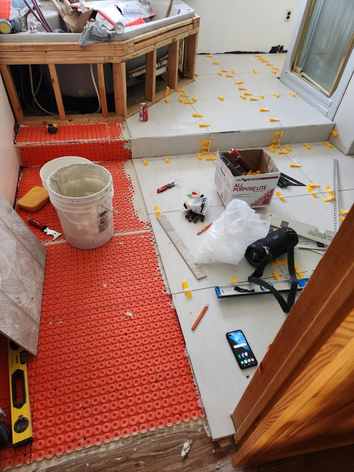 Bathroom floor mid-tiling